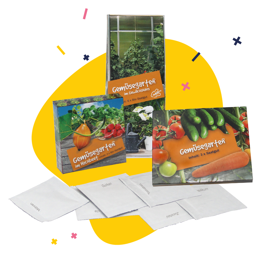 Gemüsesamen in drei verschieden großen Verpackungen vor einem gelben Punkt - Werbeartikel von iubilo